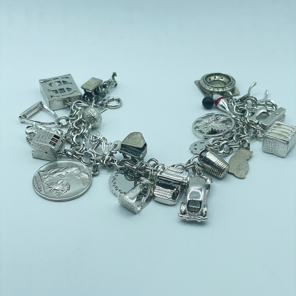 VNTG STERLING SILVER CHARM (23 charms) BRACELET 7 1/2”
